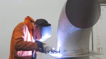 Image of welder with blowtorch
